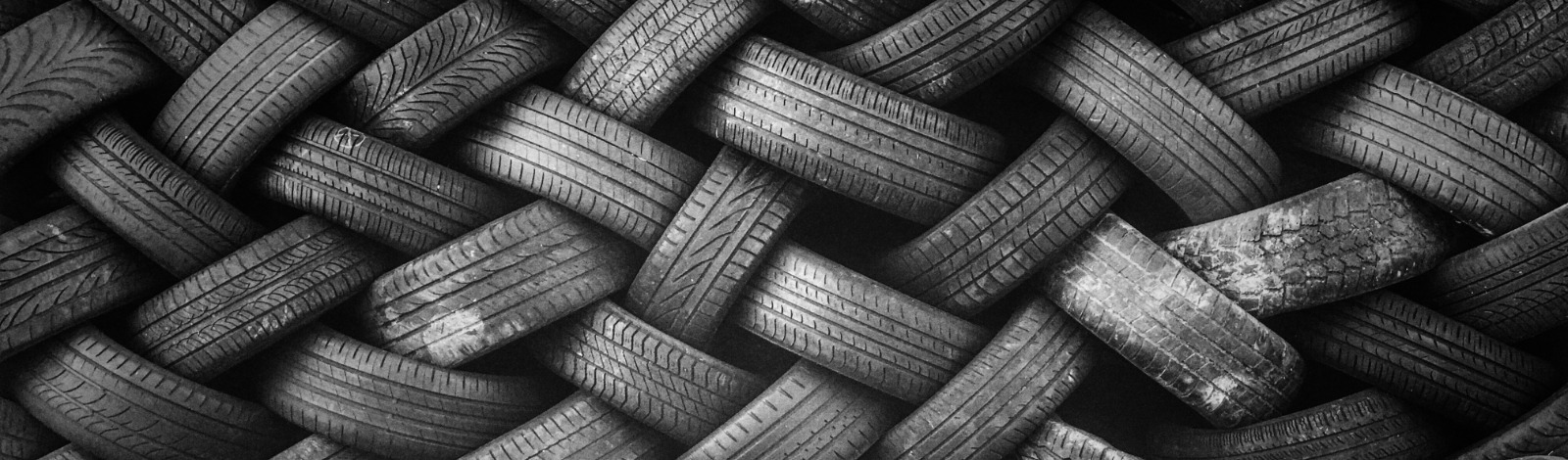 used tires stacked in a herringbone pattern