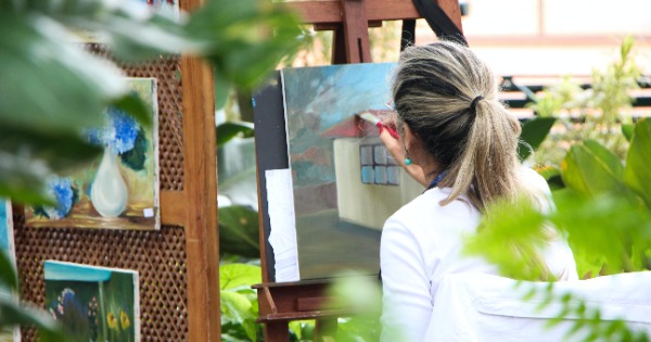 person painting outdoors