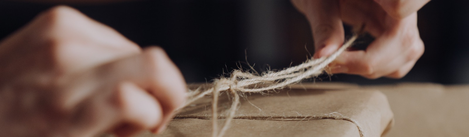 book being wrapped in kraft paper