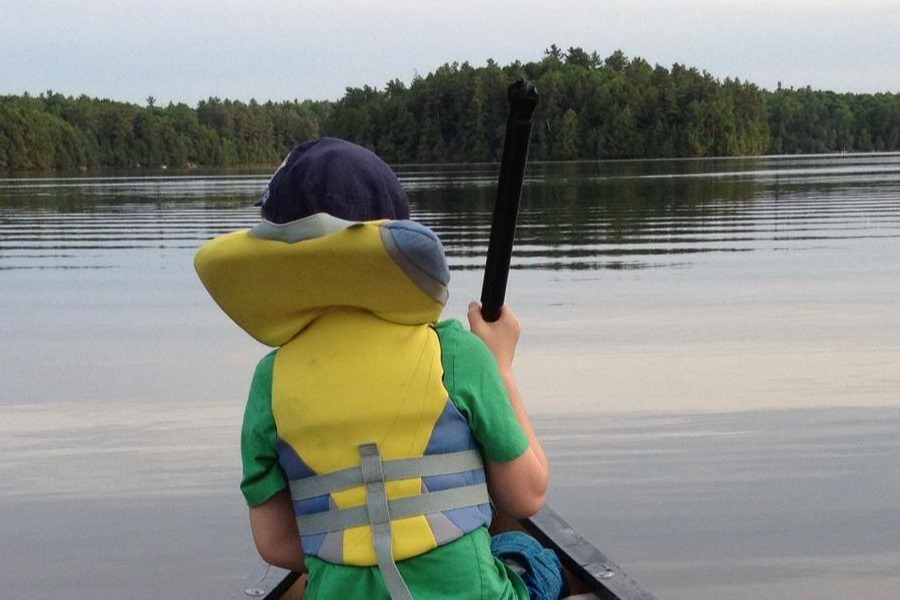 boys fishing from boat