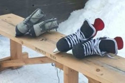 skates on wooden bench