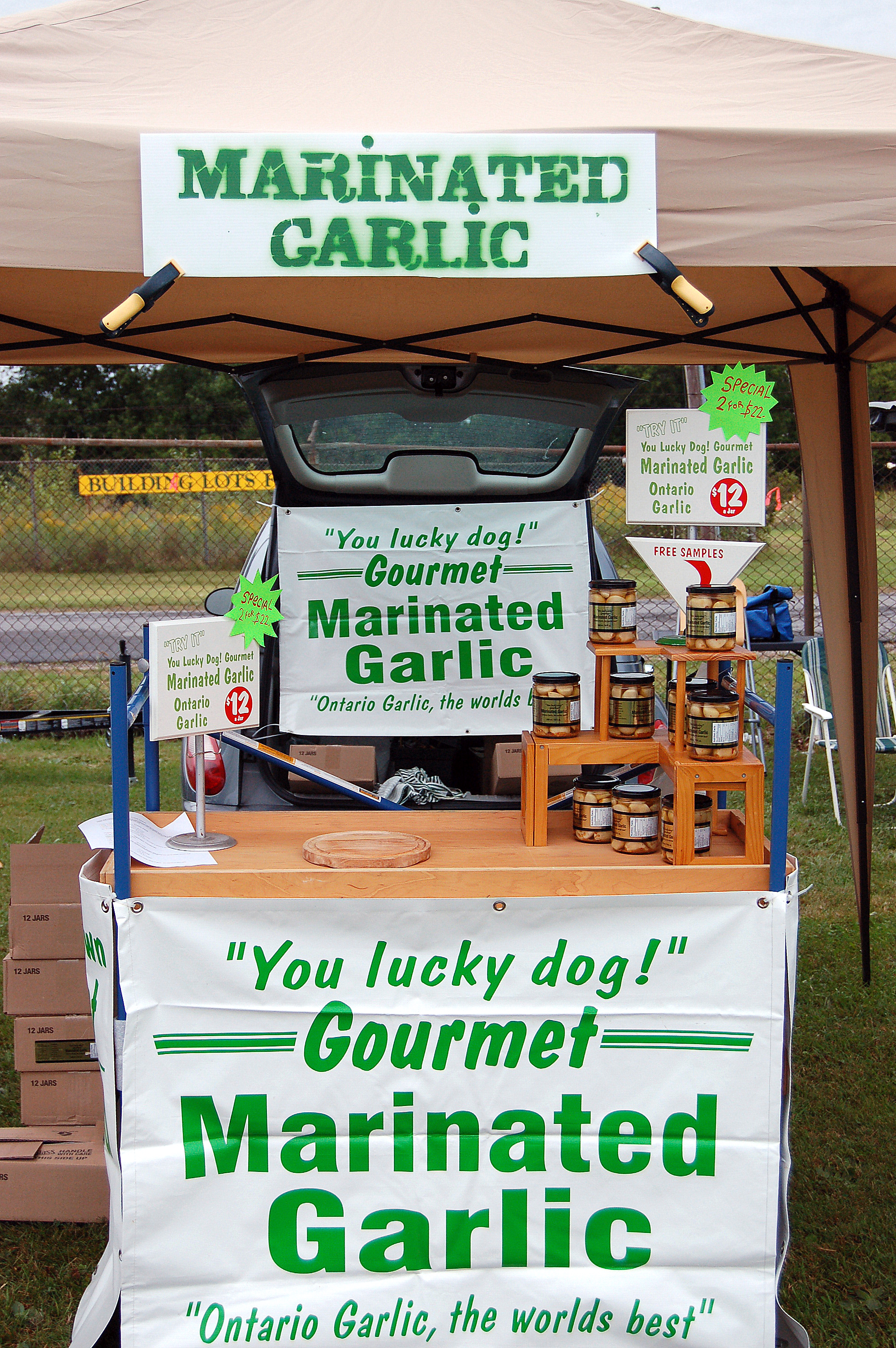 Gourmet Marinated Garlic sign and vendor area