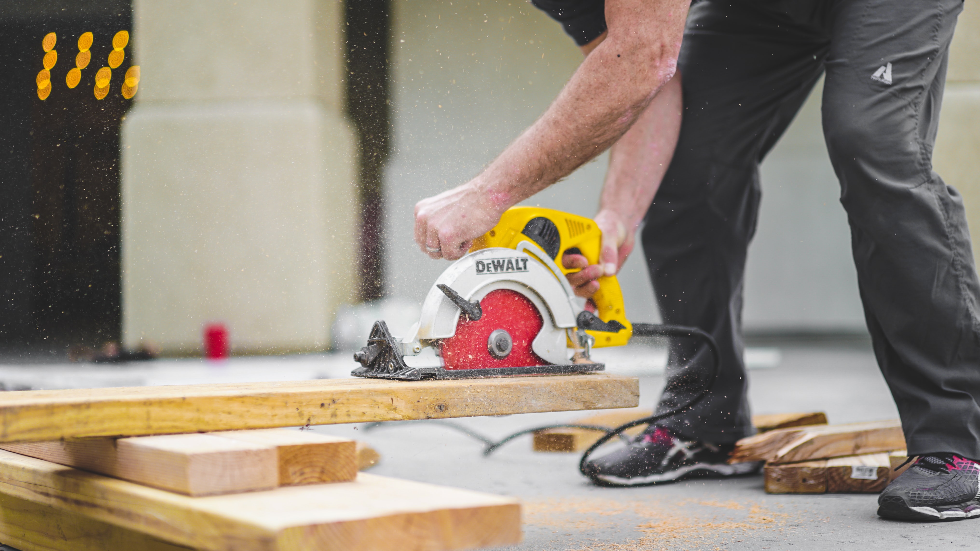 man using skill saw cutting lumber