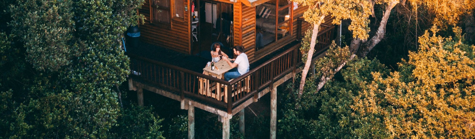 cottage on stilts in forest