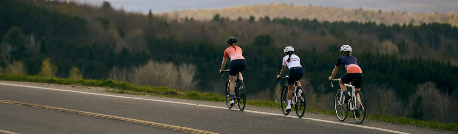 3 cyclists on a highway