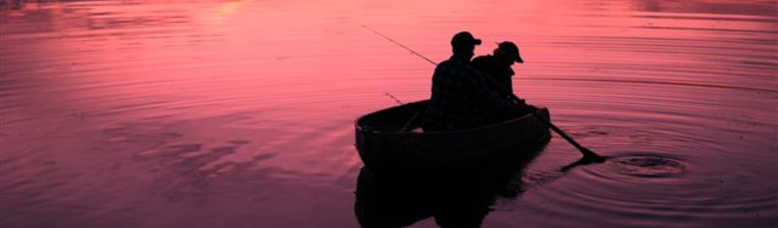 two fishermen at sunset