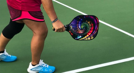 Pickleball Player and Paddle