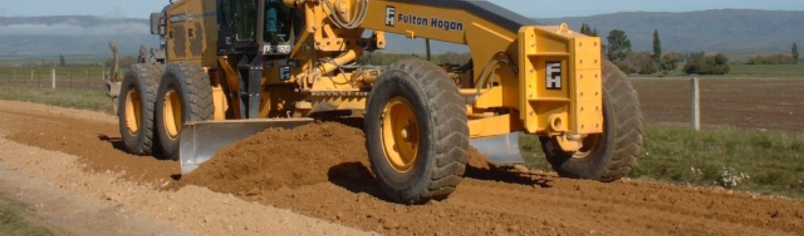 grader grading gravel road