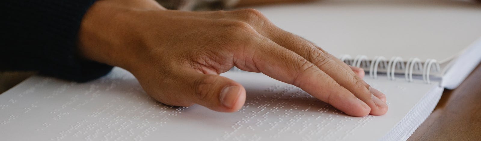 hand reading braille